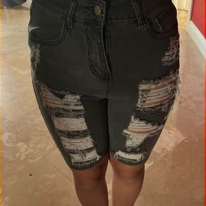 long black ripped shorts
